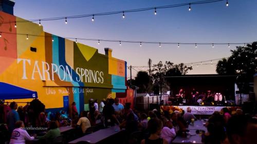 a crowd of people standing in front of a stage at Luxury heated-pool home blocks from the beach in Tarpon Springs