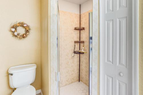 a bathroom with a shower and a toilet at 5 Mi to Sebring Intl Raceway Canal-View Retreat! in Sebring