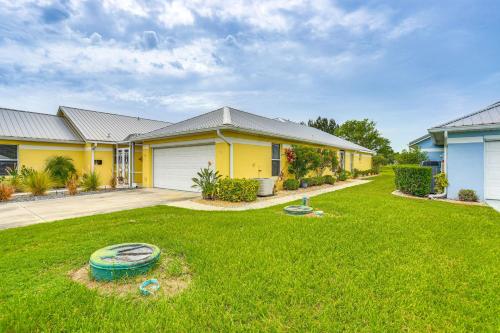 a house with a yard with a frisbee at 5 Mi to Sebring Intl Raceway Canal-View Retreat! in Sebring