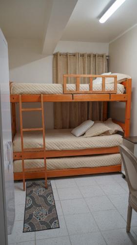 Postel nebo postele na pokoji v ubytování Habitaciones ROGA