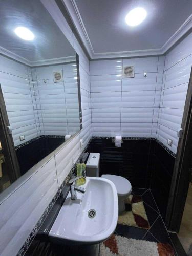 a bathroom with a sink and a toilet at complexe Jawharat tetouan in Tetouan