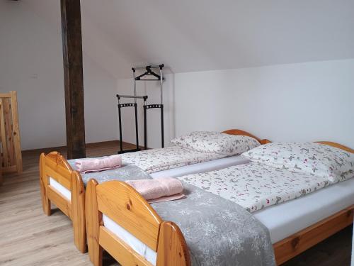 two twin beds sitting in a room at Chata Pod Różą in Lędzin