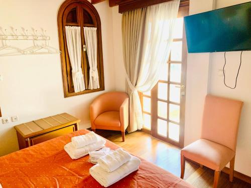 Postel nebo postele na pokoji v ubytování Dionysus Residence Pikermi