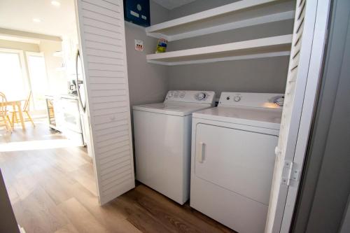 a small laundry room with a washer and dryer at 140 Capt John Fripp Villa in Fripp Island