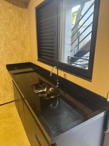 Η κουζίνα ή μικρή κουζίνα στο Suites Add Congonhas