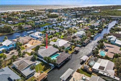 an aerial view of a small town next to the ocean at Canal Front Beach Home, Private Pool in Flagler Beach