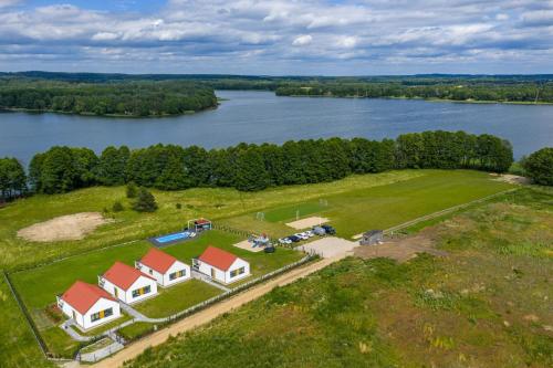 an aerial view of a large estate on a lake at Osada Kalwa in Tylkowo