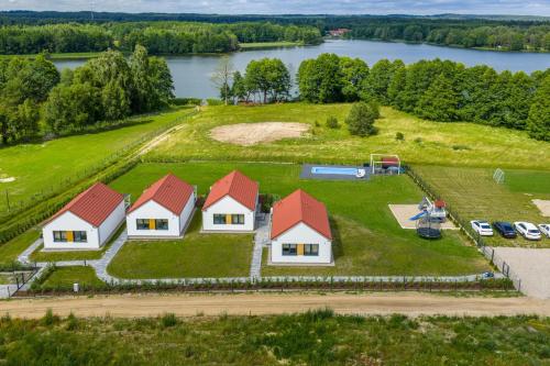 an aerial view of a house on an island with a lake at Osada Kalwa in Tylkowo