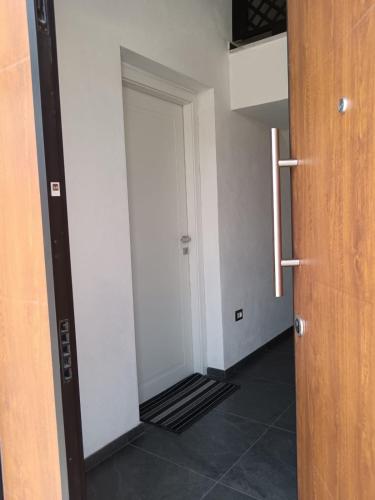 a hallway with a door leading to a room at Room private Ossi in Ossi