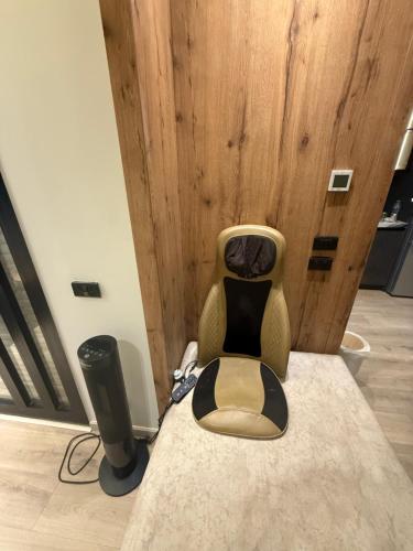 a chair and a speaker in a room at Luxury house in SODIC Villette with jacuzzi in Cairo