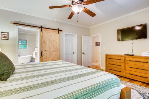 a bedroom with a bed and a ceiling fan at Sandy Beach, Fun Games and Barn Lake Lure Gem! in Lake Lure