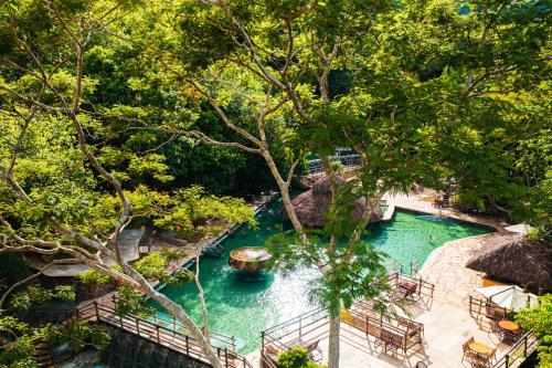 an aerial view of a pool of water in a resort at Rio Quente Resorts - Hotel Giardino in Rio Quente