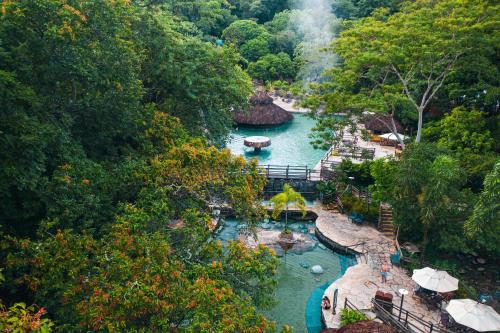 a view of a river with boats in it at Rio Quente Resorts - Hotel Giardino in Rio Quente