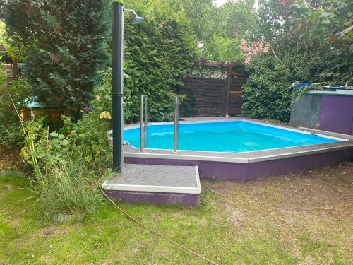 a small swimming pool in a yard at Berlin entspannt geniessen in Berlin