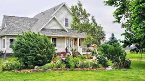 a house with a garden in the front yard at Charming Island Getaway in Kensington