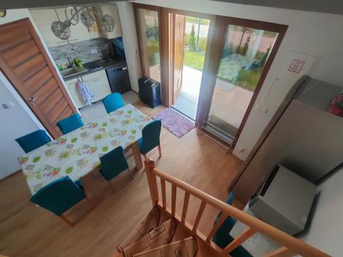 an overhead view of a dining room and kitchen with a table and chairs at House Seaside Relaxation - Nadmorski Relaks do 10 osób in Sarbinowo