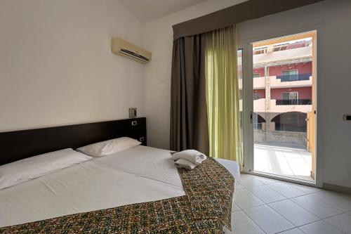 Postel nebo postele na pokoji v ubytování Aparthotel Por do Sol