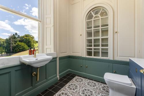 a bathroom with a sink and a window at The Hutton Suite in Marske