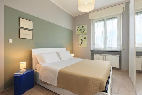 En eller flere senge i et værelse på Appartamento Dante