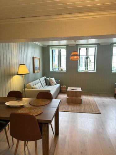 a living room with a couch and a table at Apartment in old Stavanger in Stavanger
