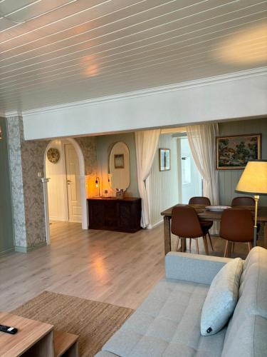 a living room with a couch and a table at Apartment in old Stavanger in Stavanger