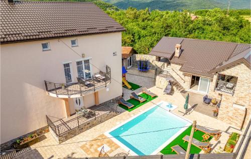 an aerial view of a house with a swimming pool at 3 Bedroom Stunning Apartment In Gracac in Gračac