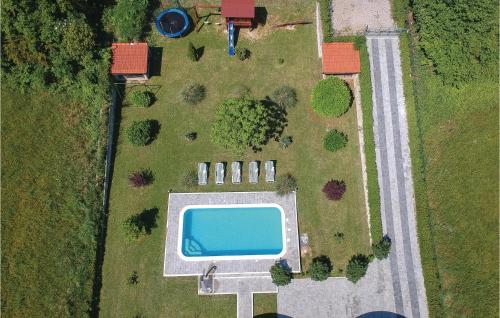 an overhead view of a swimming pool in a field at Gorgeous Home In Sinj in Sinj