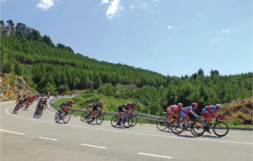 a group of people riding bikes down a road at Beautiful Apartment In Podgora in Podgora