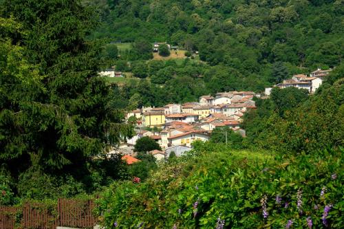 a small town on a hill with houses at Casa Pracol in Combai