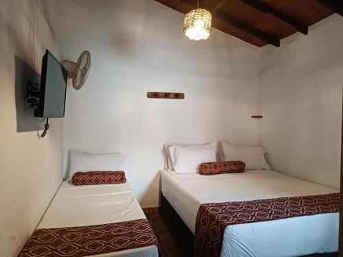 Postel nebo postele na pokoji v ubytování MONCOGUA Casa de Hospedaje