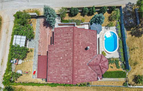 an aerial view of a house with a swimming pool at 3 Bedroom Awesome Home In Badanj in Drniš