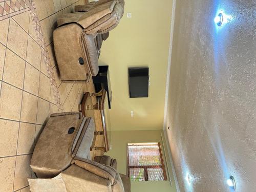 a bathroom with a toilet in a room at Bugera's Palace in Pretoria