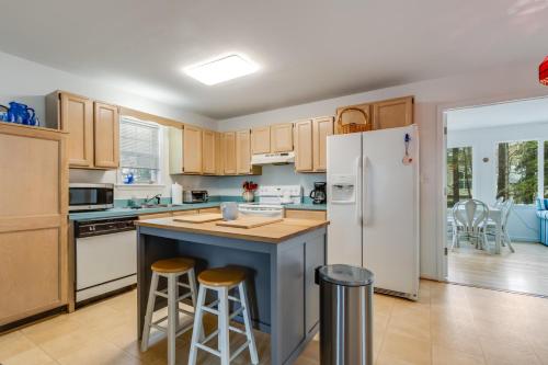 a kitchen with wooden cabinets and a white refrigerator at Columbia avenue 17 in Ocean View