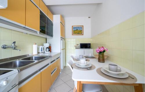a kitchen with a sink and a counter at Lovely Apartment In Rabac in Rabac