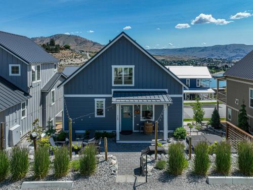 a home with a blue house at The Pour House #127 in Chelan
