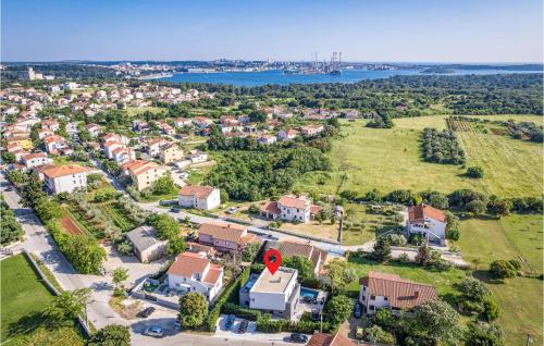 an aerial view of a suburb with houses and a road at Stunning Home In Pula in Pula