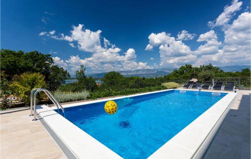 a swimming pool with a ball in the water at Cozy Home In Klimno With Wifi in Klimno