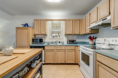 a kitchen with wooden cabinets and white appliances at Columbia avenue 17 in Ocean View
