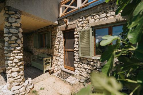 an outside view of a stone house with a window at Baglyashegy Vendégház in Sümeg