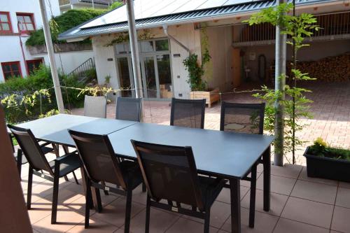 a blue table and chairs on a patio at Apartments in Fischbach bei Dahn - Pfälzerwald 42914 in Fischbach bei Dahn