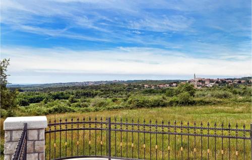 a fence with a view of a city at Villa Carolus Barat in Barat