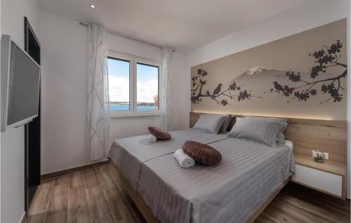 a bedroom with a bed with two stuffed animals on it at Villa Royal House 3 in Pašman