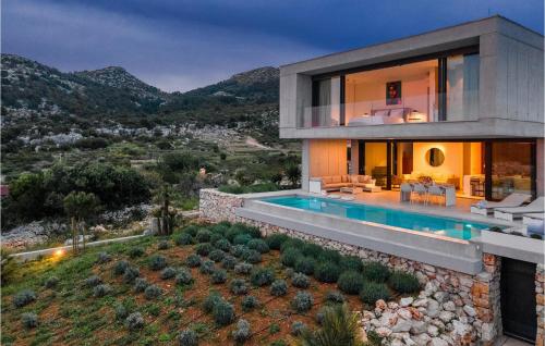 a villa with a swimming pool in the mountains at Villa Magic Sunset in Hvar