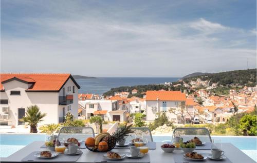 a table with food and a view of a city at Villa Magic Sunset in Hvar