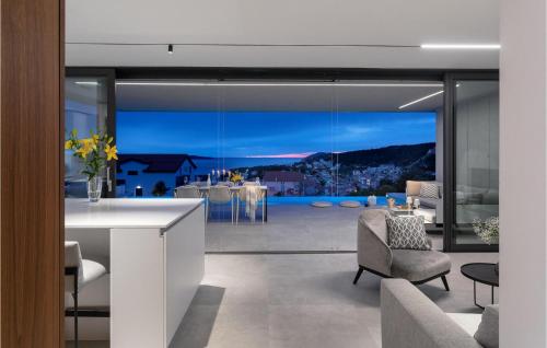 a living room with a view of a house at Villa Magic Sunset in Hvar