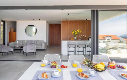 a living room with a table with food on it at Villa Magic Sunset in Hvar