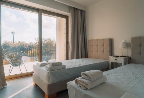 A bed or beds in a room at Villa Riza