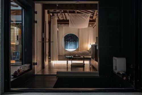 a hallway with a table and a couch in a room at Stay Yeojin Yeomong in Gyeongju