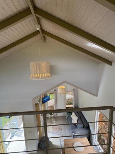 a chandelier hanging from the ceiling of a room at Tiny House at Finca Haug in San Pablo
