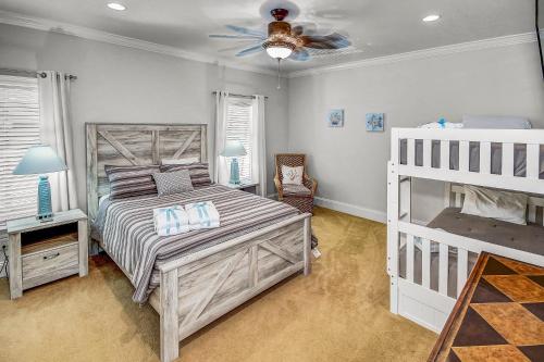 a bedroom with a bed and a ceiling fan at 136 La Valencia Cir - At Peace in Sunnyside